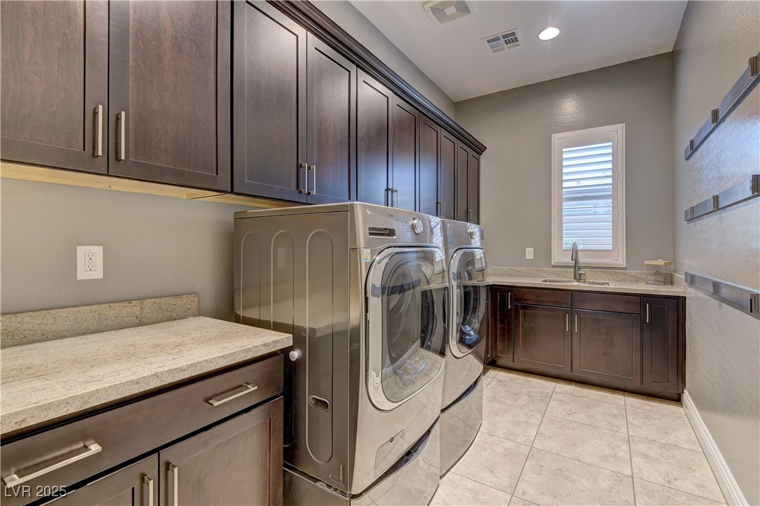 8411 South Cimarron Road Las Vegas, NV 89113 - Photo 28 of 46 Large laundry room with 1 year old top-of-the line LG washer and dryer with pedestal washer