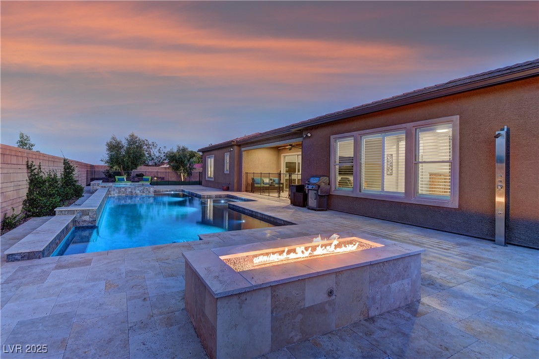 8411 South Cimarron Road Las Vegas, NV 89113 - Photo 31 of 46 Large grandfathered-in pool and spa with fire pit feature