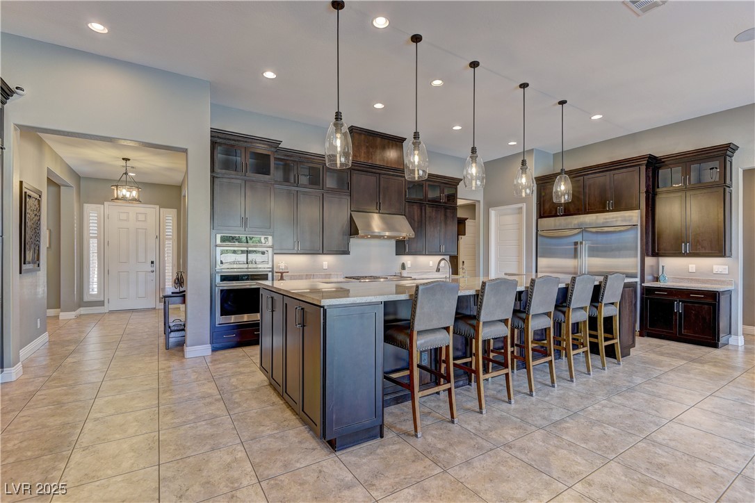 8411 South Cimarron Road Las Vegas, NV 89113 - Photo 4 of 46 Professional kitchen with top-of-the-line GE Monogram appliances