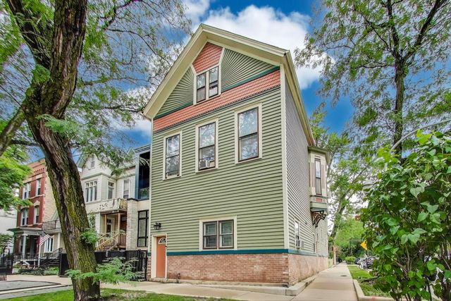 a view of a house with a tree