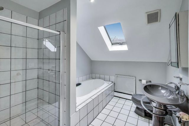 a bathroom with a sink and a shower