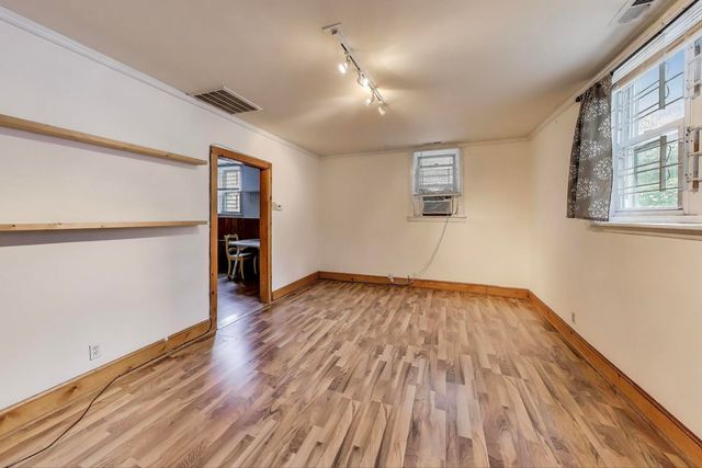 a kitchen with stainless steel appliances granite countertop a refrigerator a stove a sink and a microwave