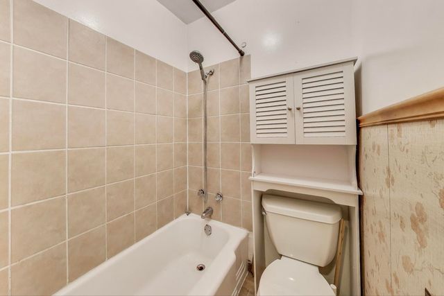 a view of a balcony with a table and chairs