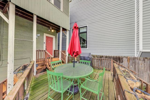 a view of deck with patio and outdoor seating
