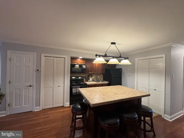 a kitchen with a table and chairs in it