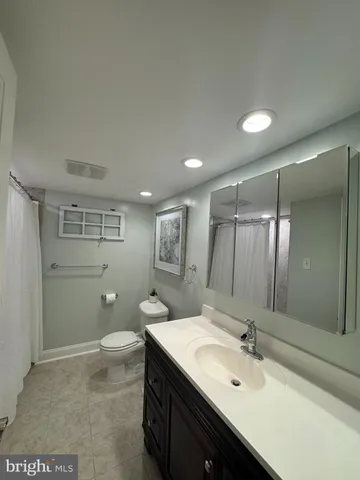 a bathroom with a shower and a bath tub