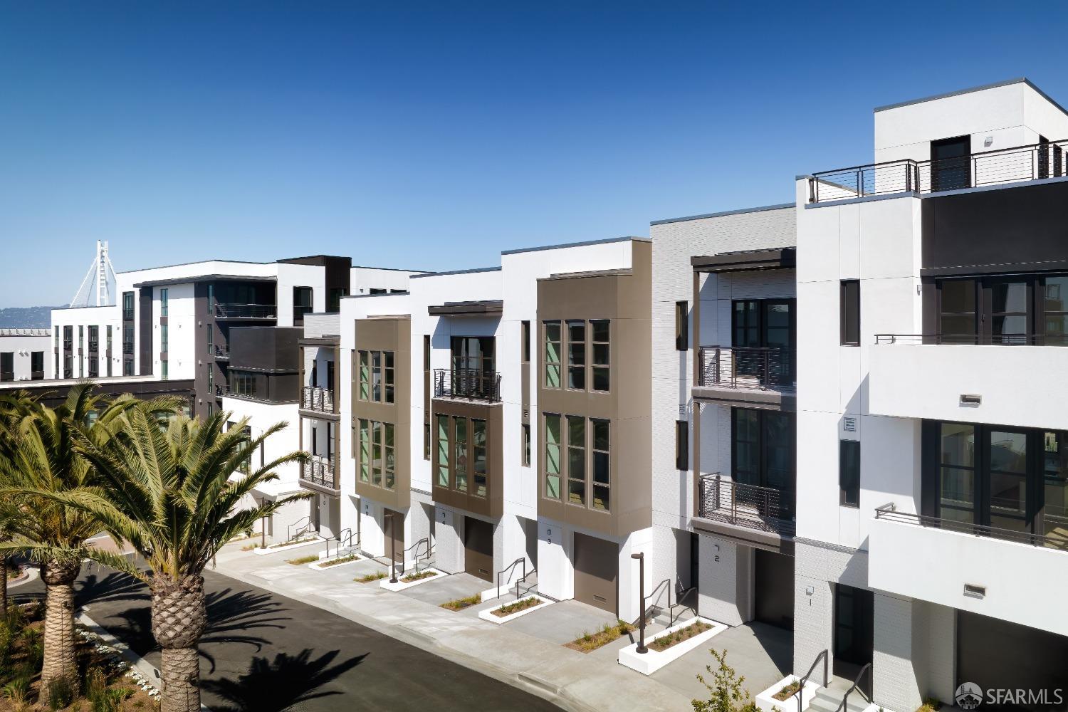 38 Meadow Hill Drive, Unit 2 San Francisco, CA 94130 - Photo 25 of 51 a living room with furniture a flat screen tv and kitchen view