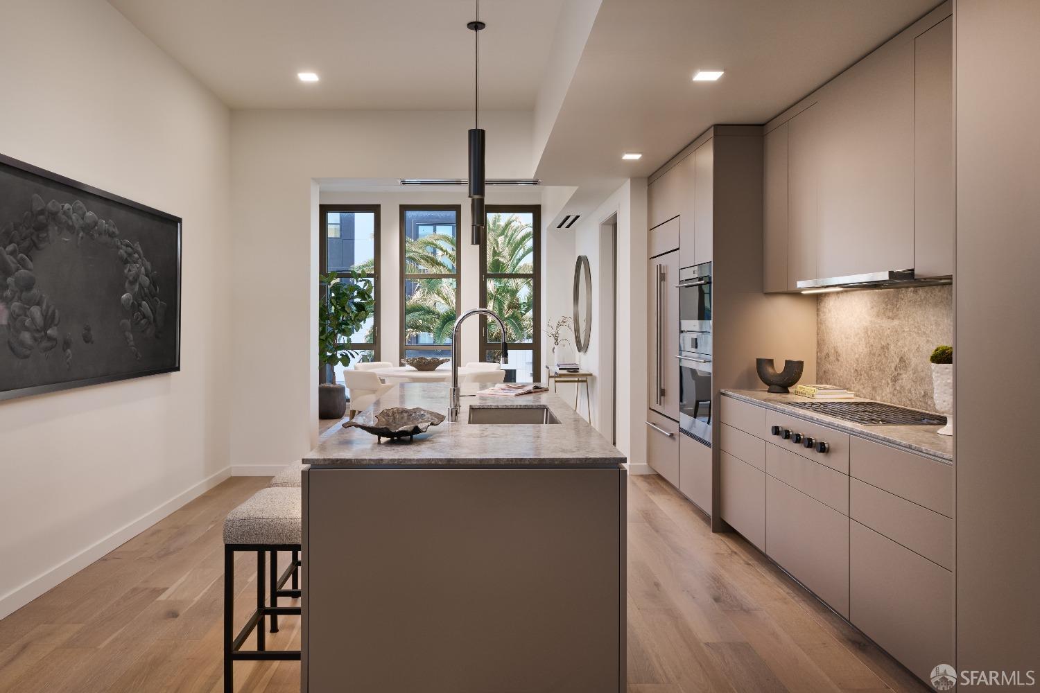 38 Meadow Hill Drive, Unit 2 San Francisco, CA 94130 - Photo 4 of 51 a kitchen with stainless steel appliances granite countertop a sink a stove and a refrigerator
