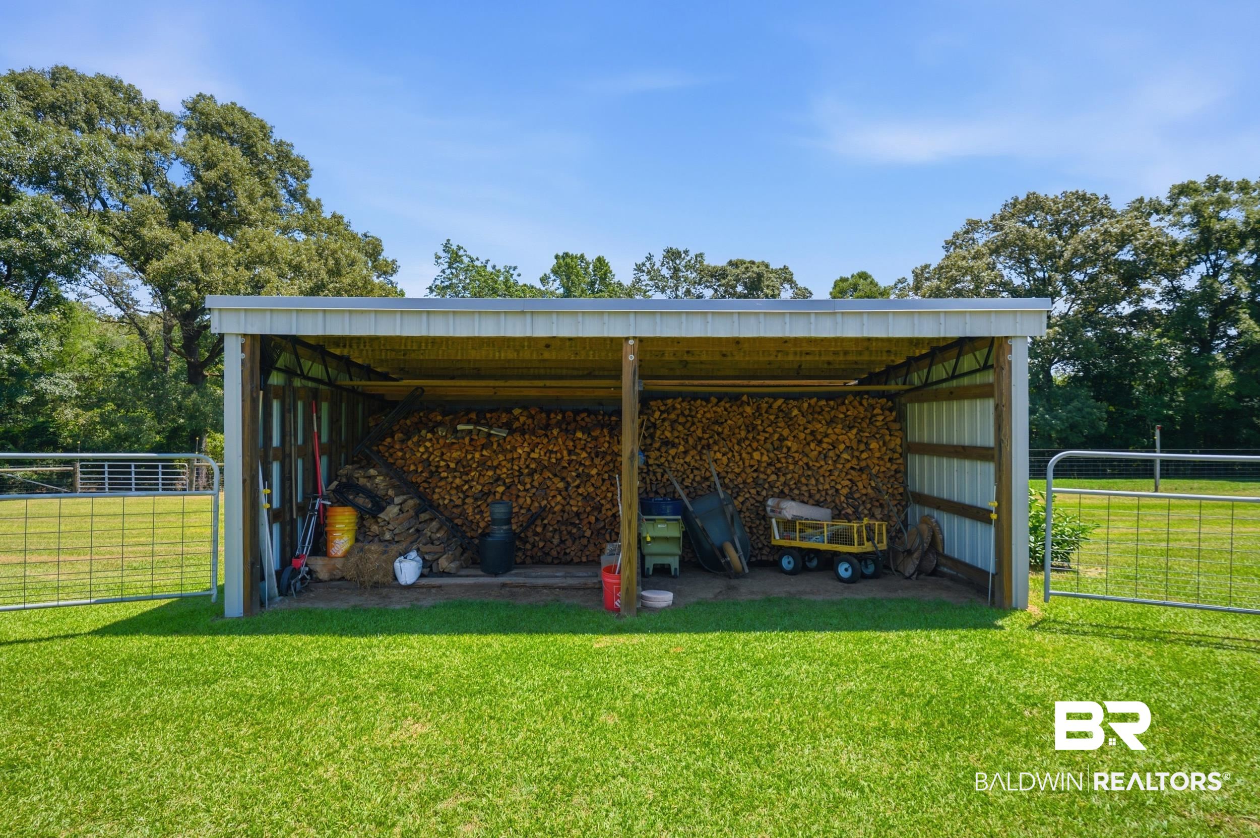 15855 Calvin Richerson Road Bay Minette, AL 36507 - Photo 65 of 83 Detached open-sided shed with a metal roof and wood frame construction