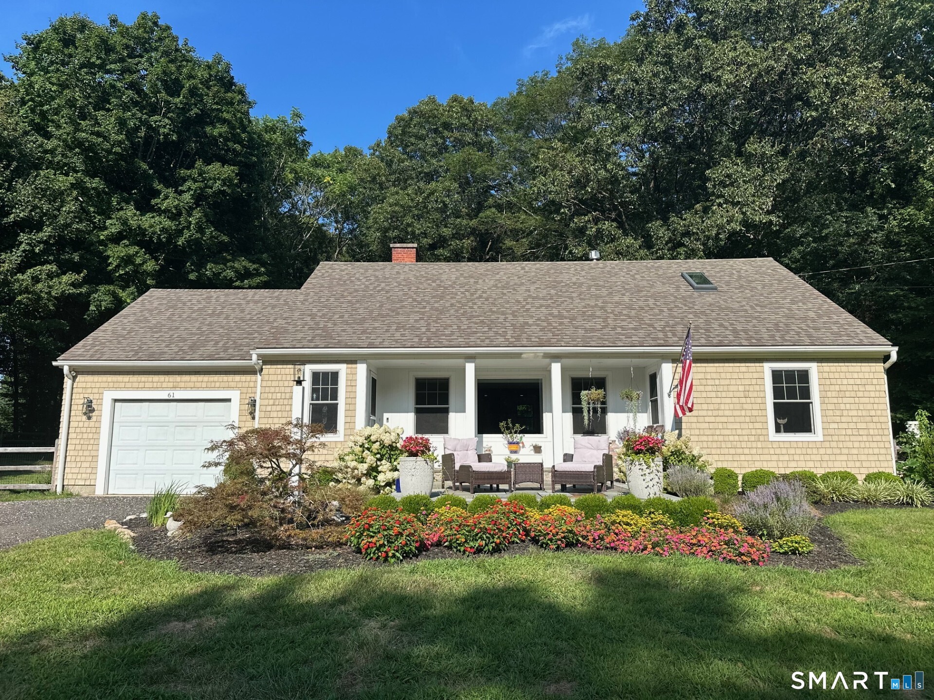 a front view of house with yard and green space