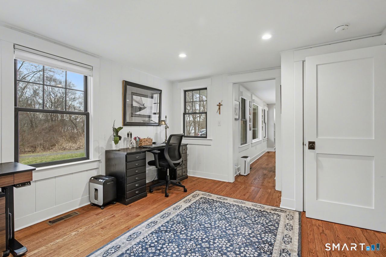 61 Bishop Lane Madison, CT 06443 - Photo 21 of 41 a bed room with a bed and glass window