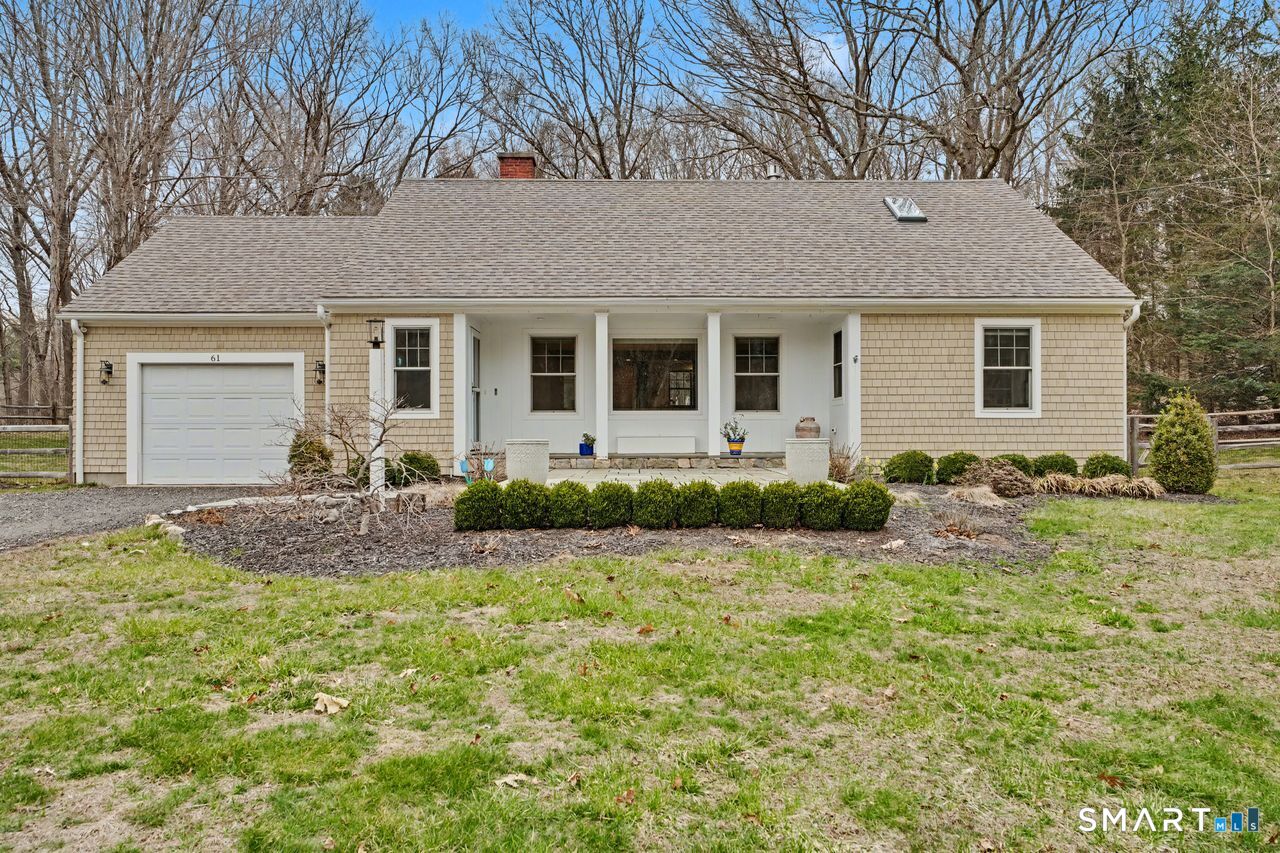 61 Bishop Lane Madison, CT 06443 - Photo 3 of 41 a front view of a house with garden
