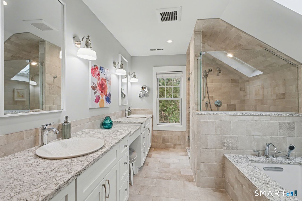 61 Bishop Lane Madison, CT 06443 - Photo 34 of 41 a bathroom with a granite countertop sink a mirror and a shower