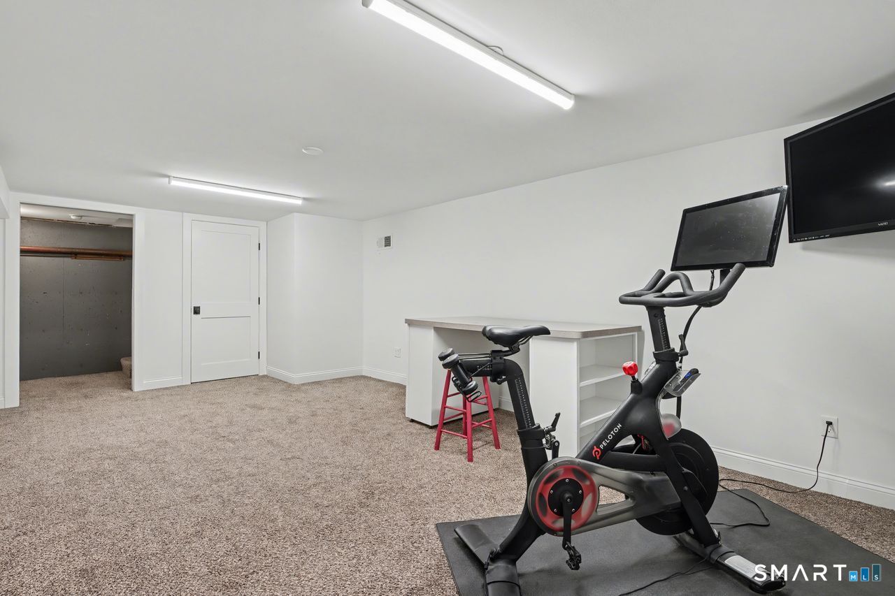 61 Bishop Lane Madison, CT 06443 - Photo 35 of 41 a view of a room with gym equipment