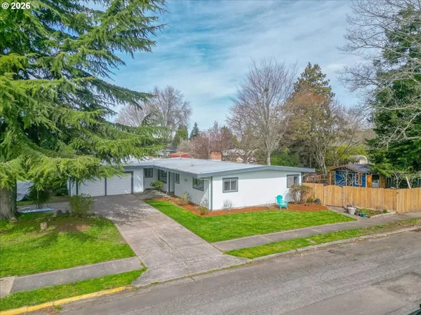 a front view of house with yard and green space