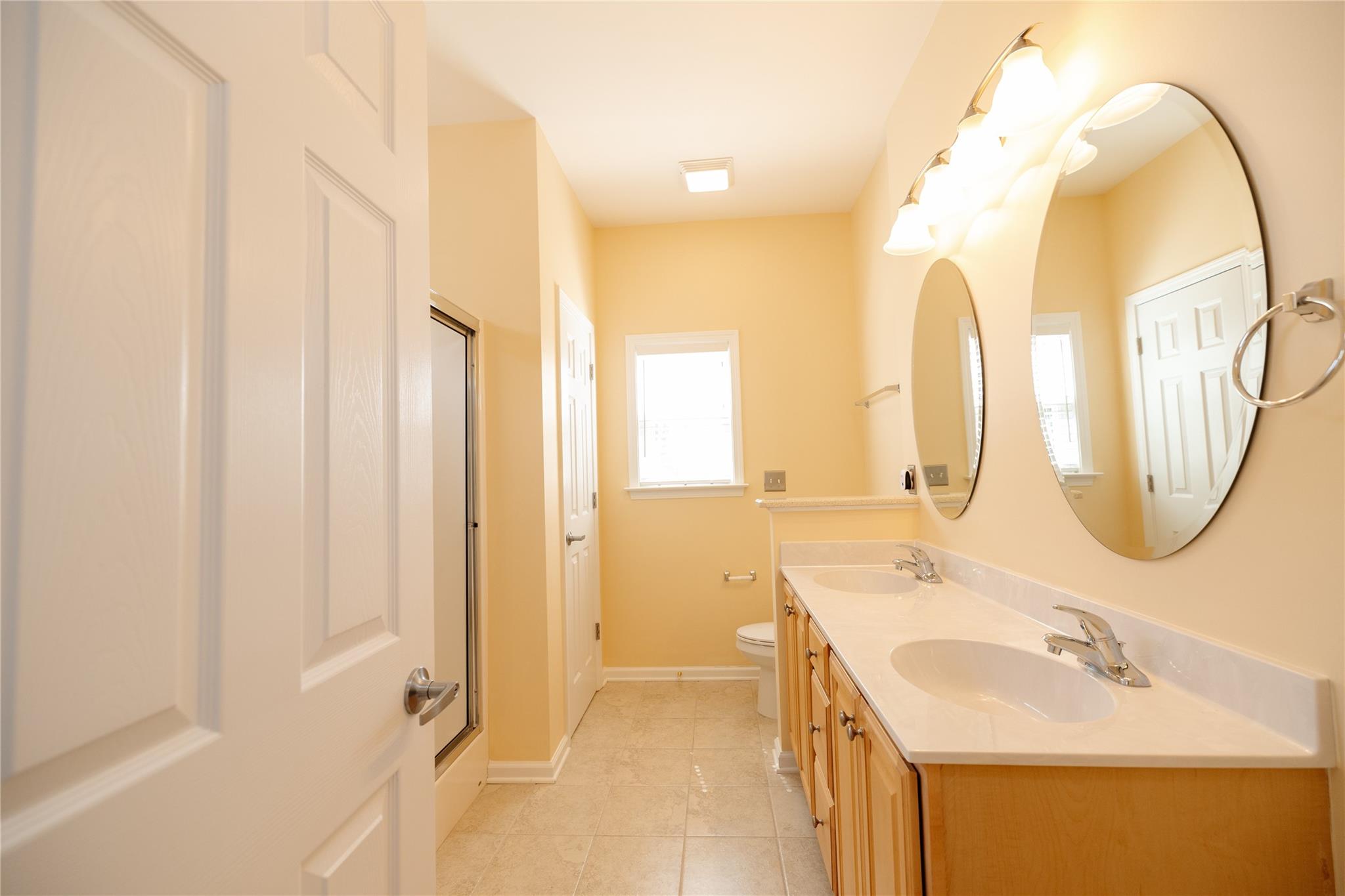 330 West Swift Creek Road Fletcher, NC 28732 - Photo 13 of 29 a bathroom with a double vanity sink mirror and a bathtub