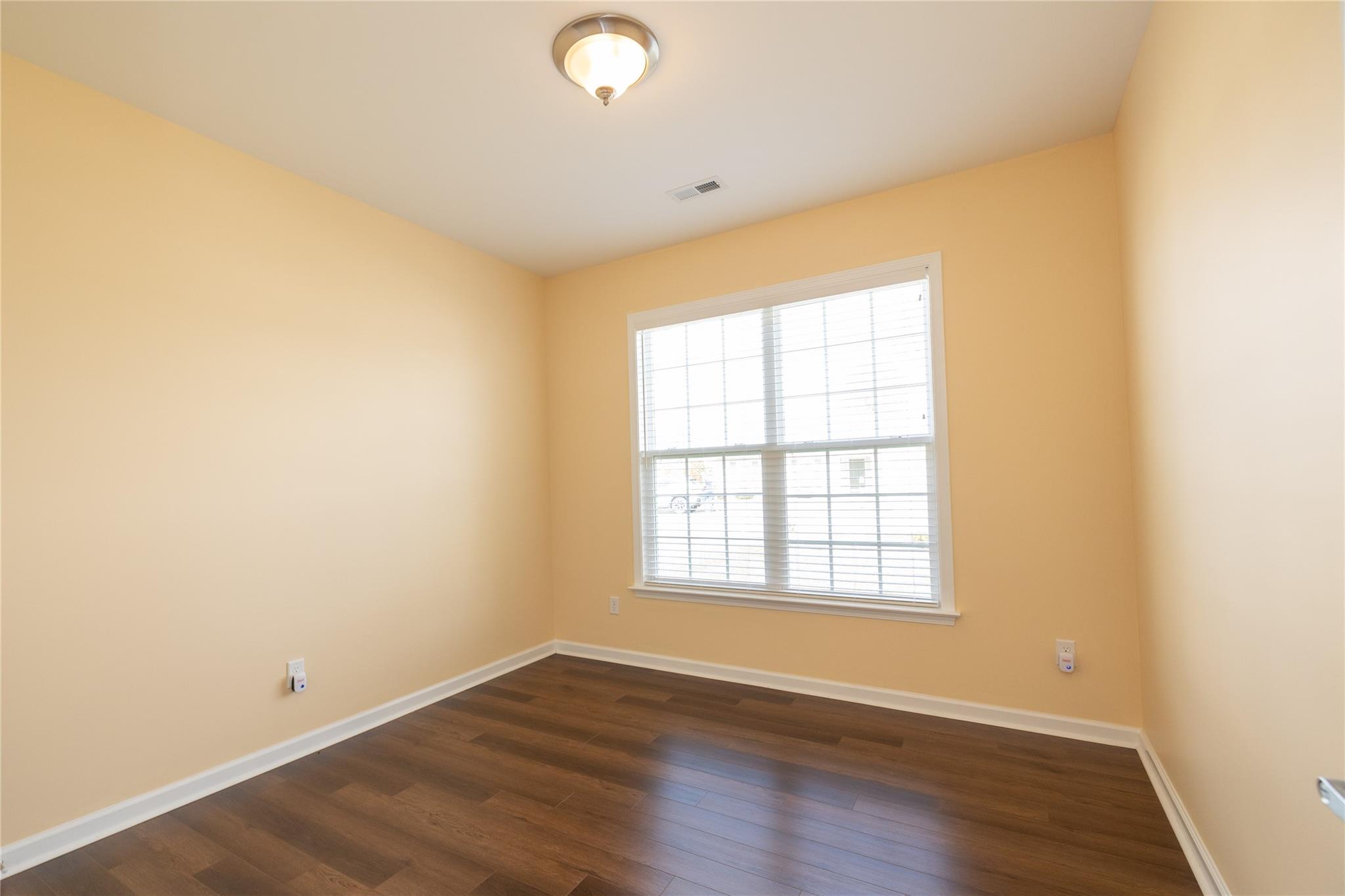 330 West Swift Creek Road Fletcher, NC 28732 - Photo 18 of 29 an empty room with wooden floor and windows