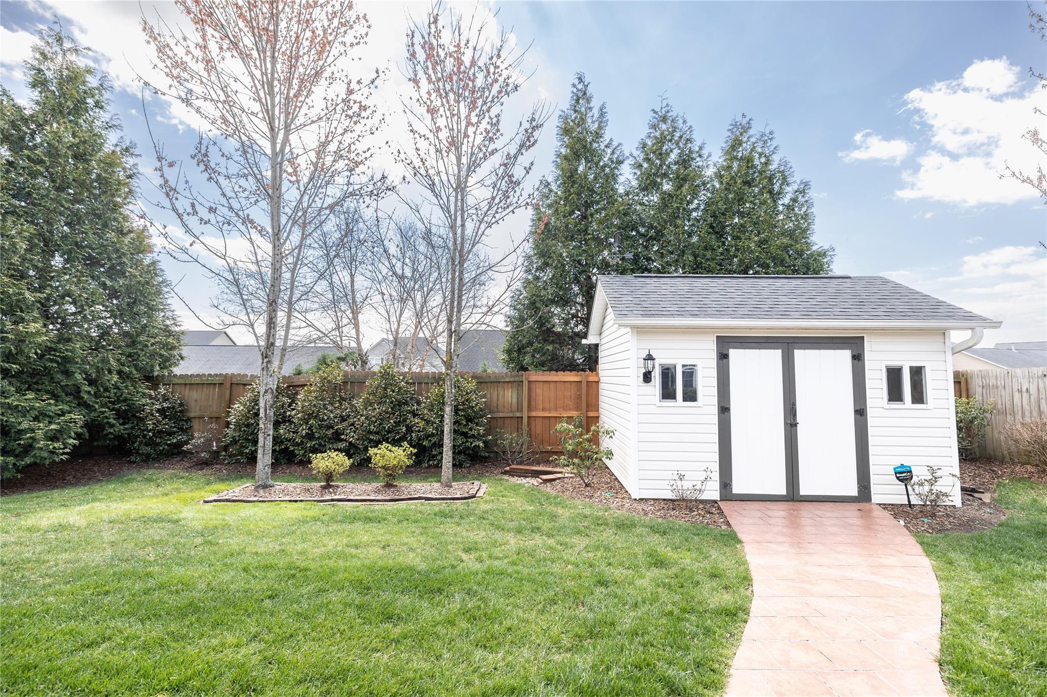 330 West Swift Creek Road Fletcher, NC 28732 - Photo 25 of 29 a view of a house with backyard and a tree
