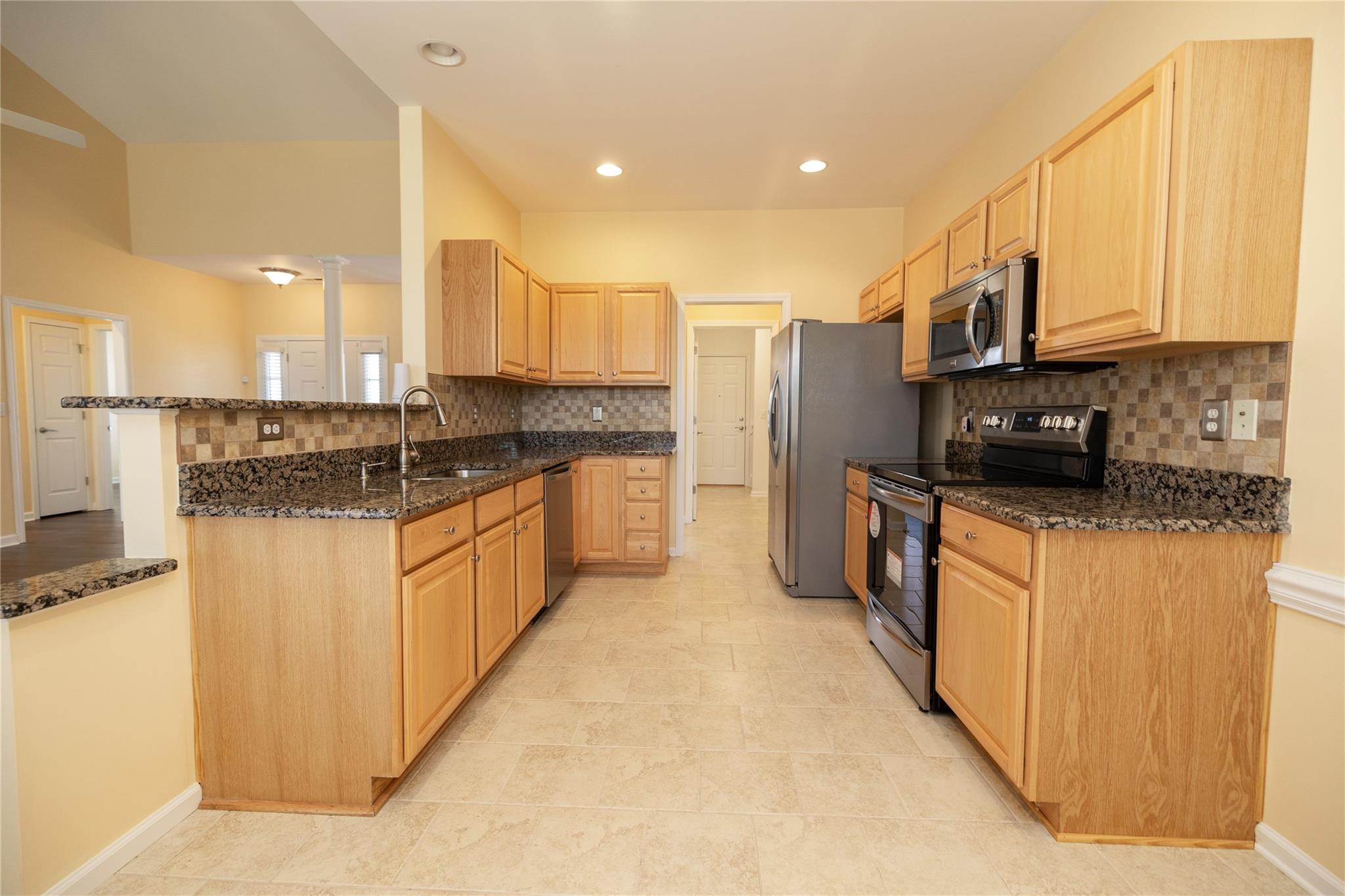 330 West Swift Creek Road Fletcher, NC 28732 - Photo 6 of 29 a kitchen with stainless steel appliances granite countertop a stove a sink and a refrigerator