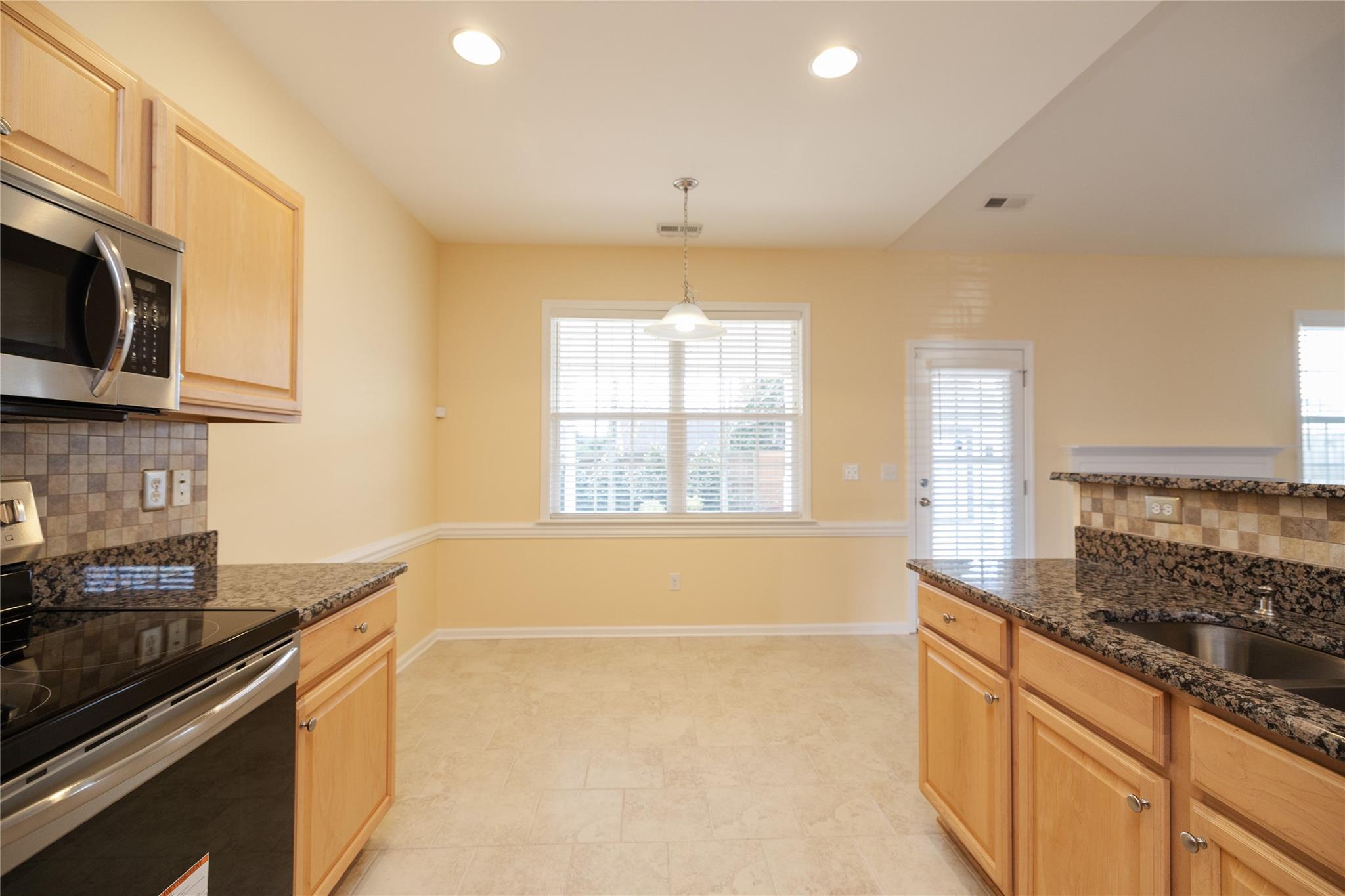 330 West Swift Creek Road Fletcher, NC 28732 - Photo 7 of 29 a kitchen with stainless steel appliances granite countertop a sink and a stove