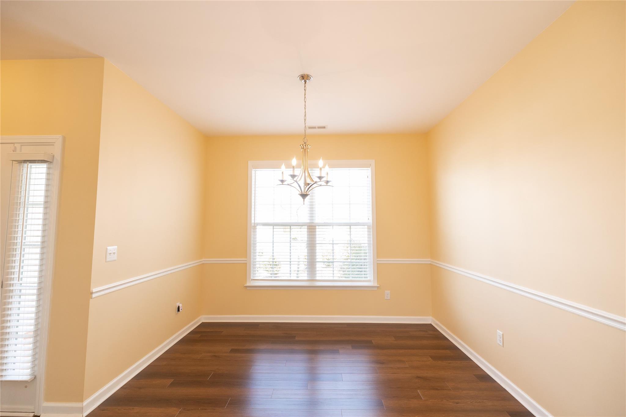 330 West Swift Creek Road Fletcher, NC 28732 - Photo 8 of 29 a view of an empty room with wooden floor and a window