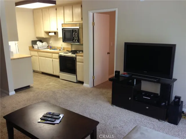 a kitchen with a stove and a microwave