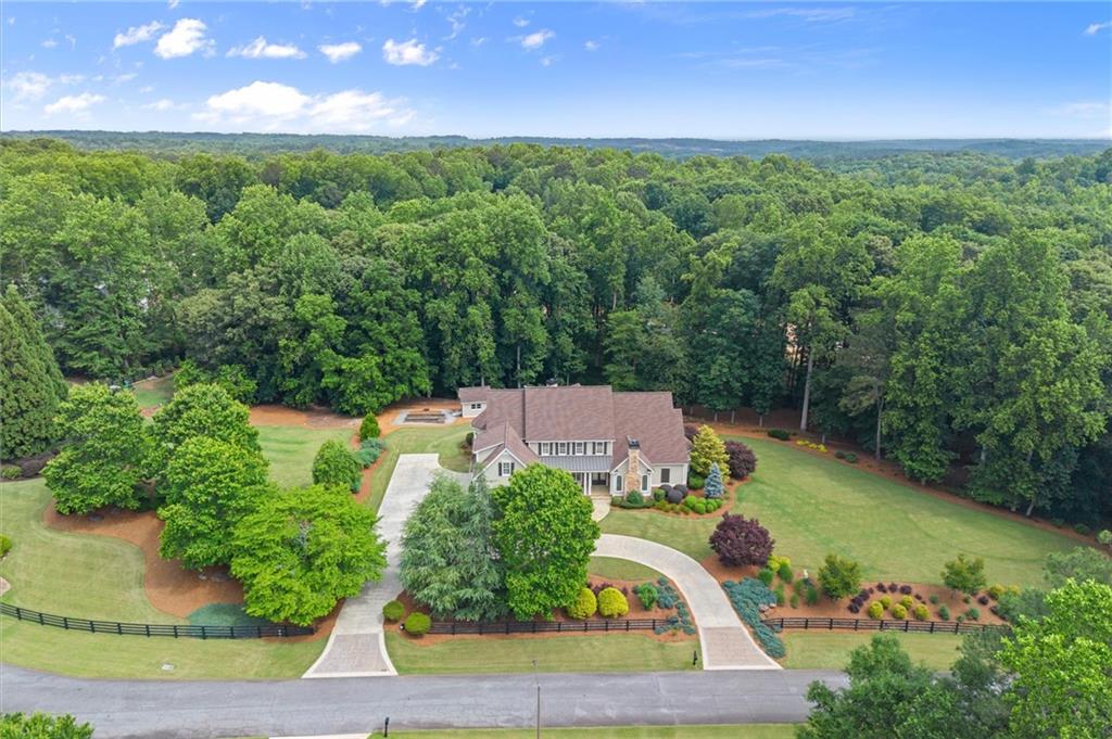 322 Edwards Brook Lane Canton, GA 30115 - Photo 93 of 99 an aerial view of a house with a yard and lake view