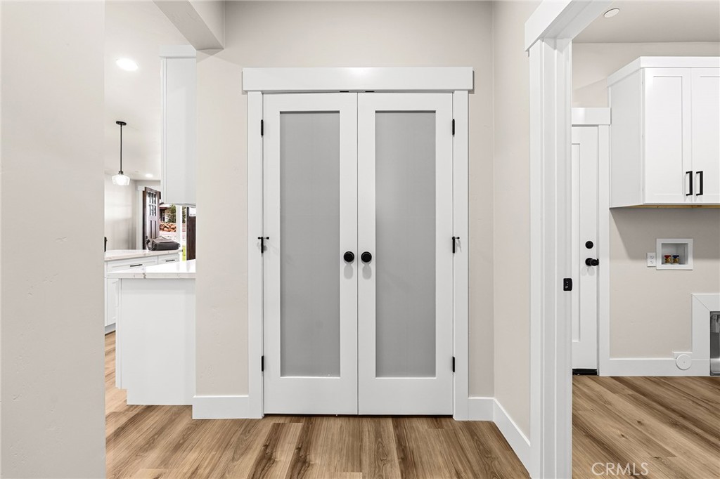 707 Madrone Way Paradise, CA 95969 - Photo 12 of 47 a view of a hallway with wooden floor and closet area