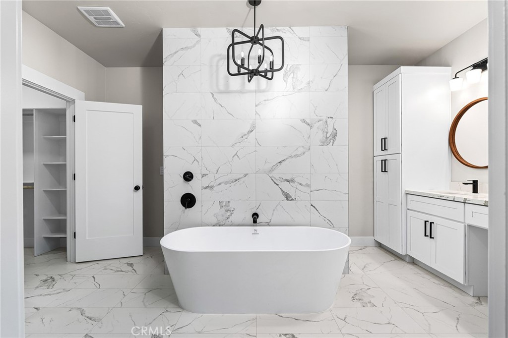 707 Madrone Way Paradise, CA 95969 - Photo 15 of 47 a bathroom with a bathtub and a shower