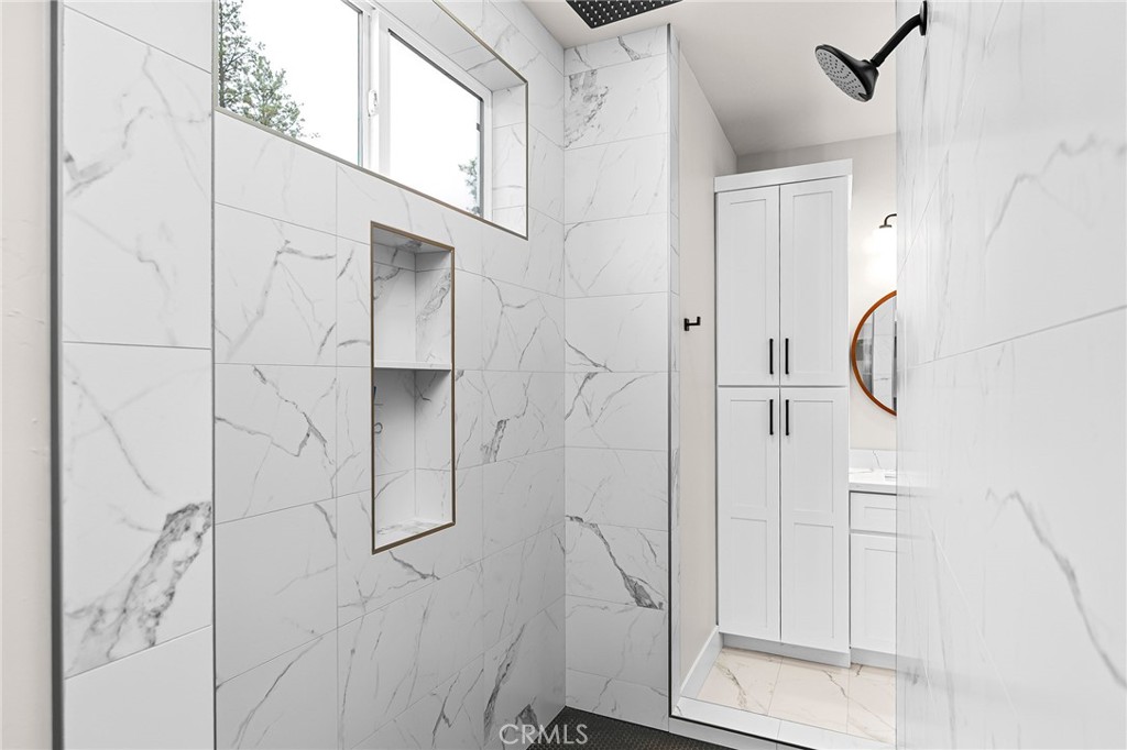 707 Madrone Way Paradise, CA 95969 - Photo 18 of 47 a bathroom with a glass shower door and a bathroom