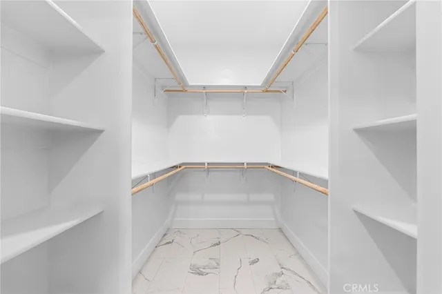 a view of an empty walk in closet