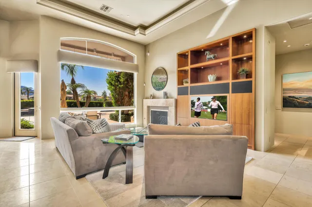 a bedroom with a bed and glass window