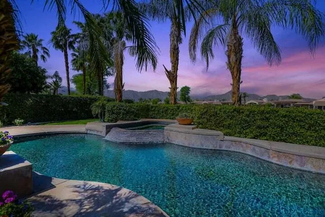 a kitchen with stainless steel appliances granite countertop a sink and a counter top space