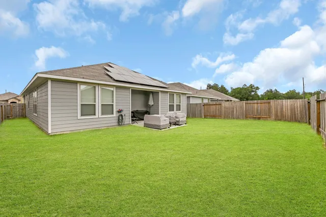 a front view of a house with yard