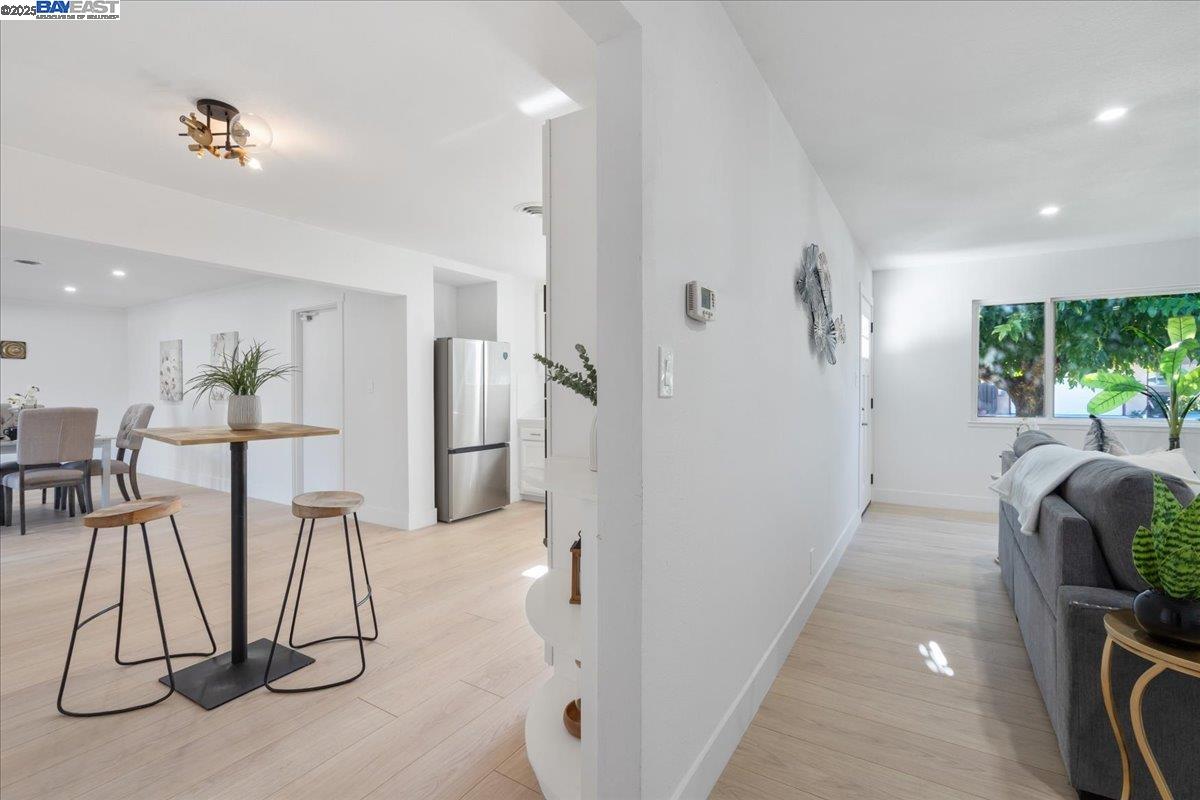 4023 Roland Drive Concord, CA 94521 - Photo 12 of 59 a view of a hallway with wooden floor and windows