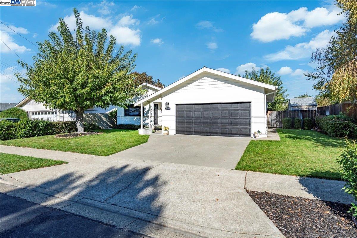 4023 Roland Drive Concord, CA 94521 - Photo 2 of 59 a front view of a house with a yard and garage