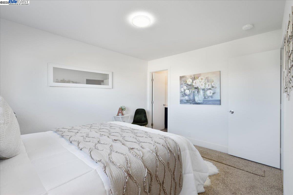 4023 Roland Drive Concord, CA 94521 - Photo 33 of 59 a bedroom with a large bed and a window