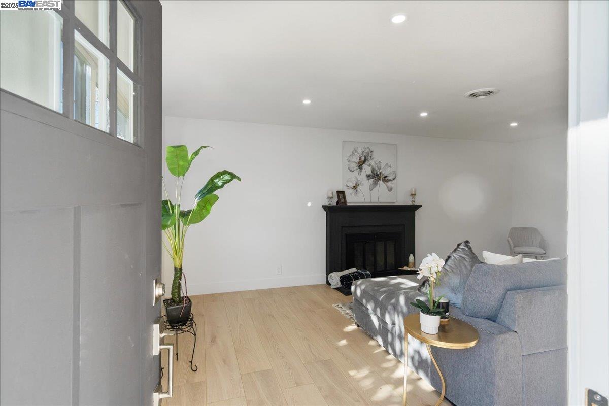4023 Roland Drive Concord, CA 94521 - Photo 7 of 59 a living room with furniture and a chandelier