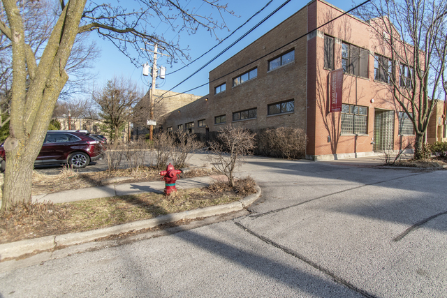 a the side of a building with traffic signal