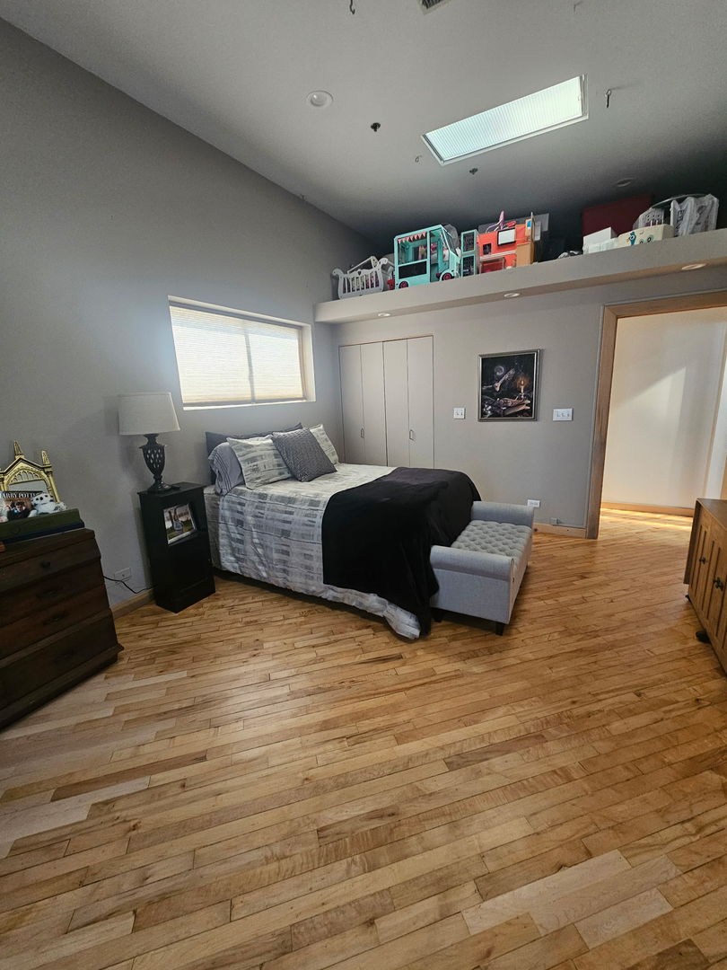 537 Custer Avenue, Unit 5 Evanston, IL 60202 - Photo 13 of 19 a bedroom with furniture and a window