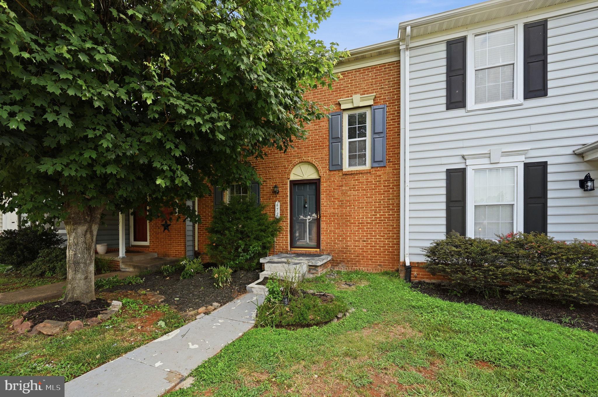 672 Ripplebrook Drive Culpeper, VA 22701 - Photo 1 of 26 Charming brick facade with lush greenery.