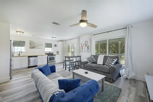 a living room with furniture and a large window