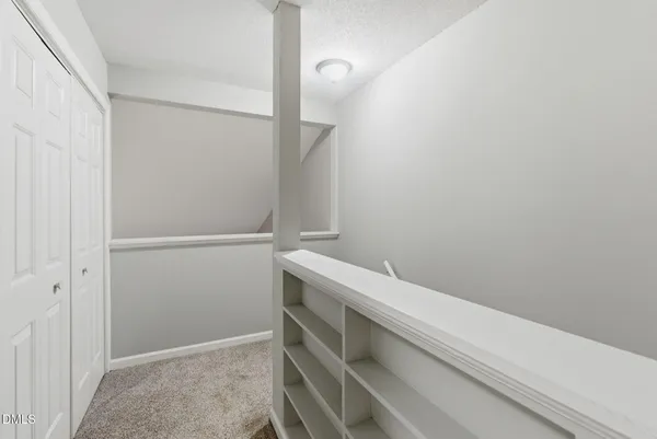 a view of an empty walk in closet