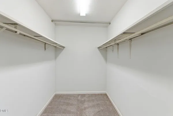 a bathroom with a shower a sink and a mirror