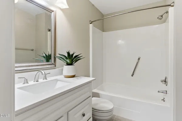 a view of a backyard with large trees