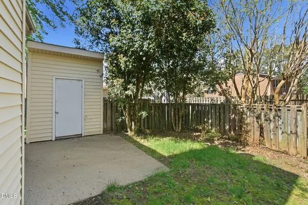 a view of a house with a tree