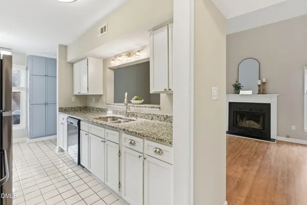 a kitchen with stainless steel appliances granite countertop a stove and a sink