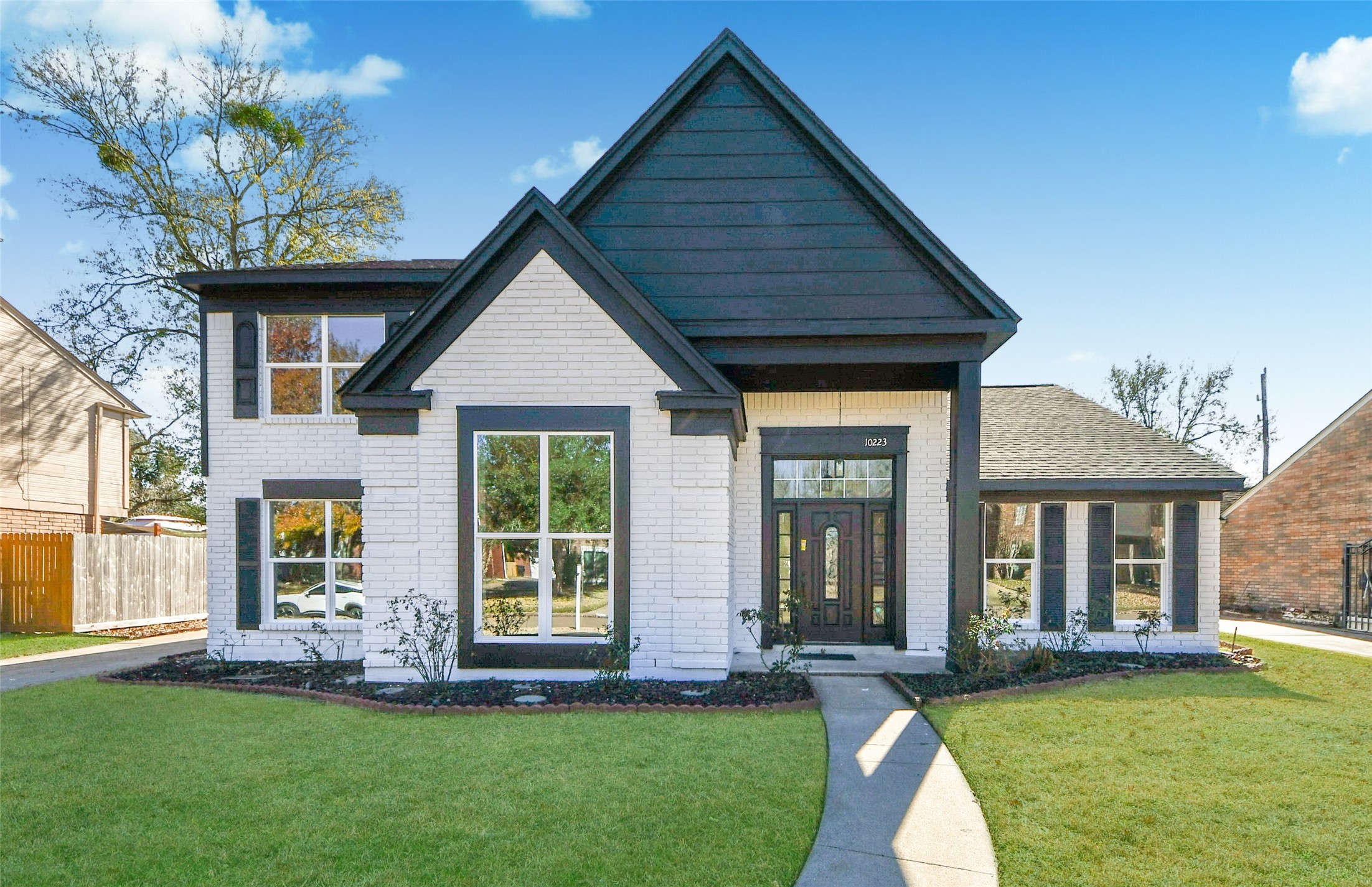 a front view of a house with a yard