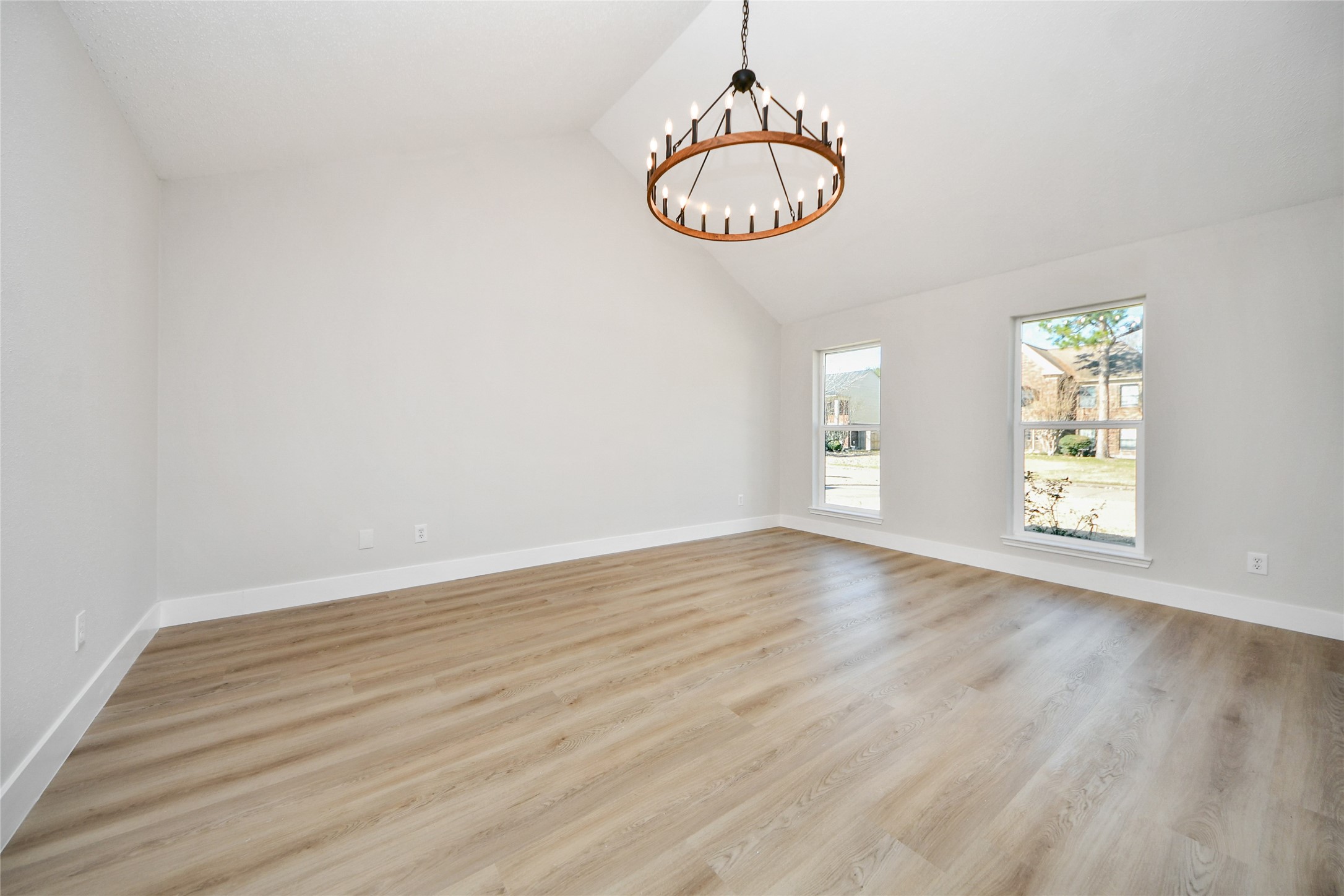 10223 Dude Road Houston, TX 77064 - Photo 22 of 44 an empty room with wooden floor and window