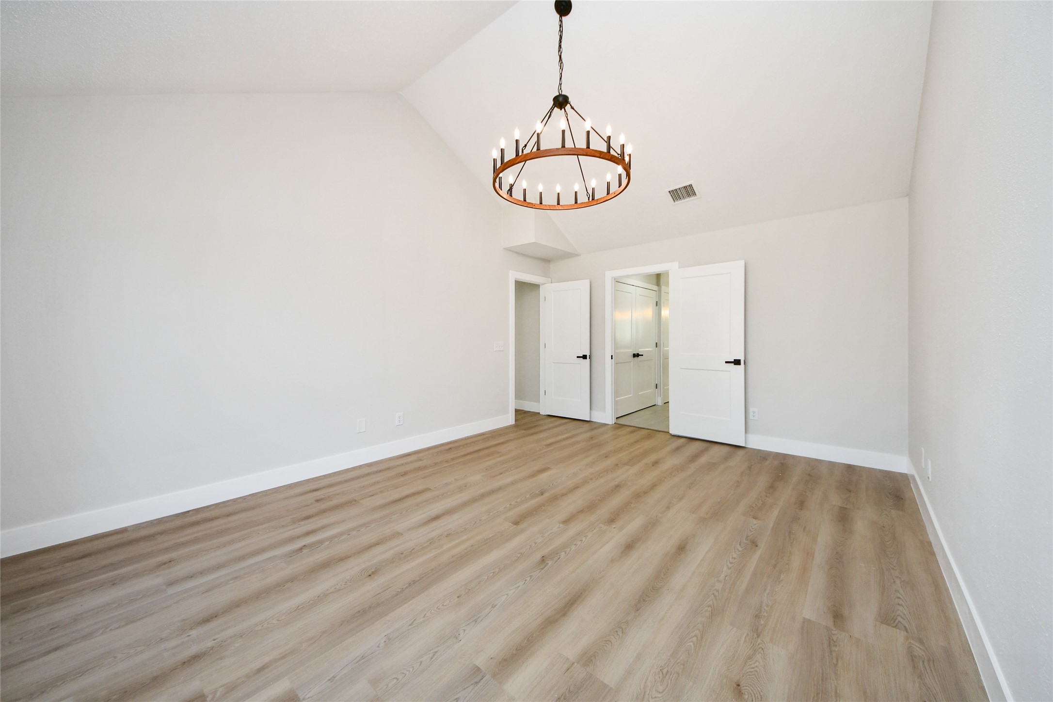 10223 Dude Road Houston, TX 77064 - Photo 23 of 44 a view of an empty room with a chandelier fan